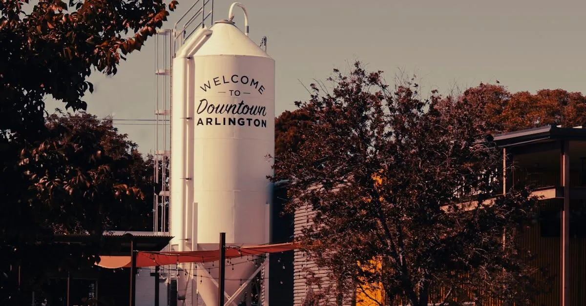 Industrial scene in Arlington, Texas featuring a prominent silo and surrounding autumn foliage.
