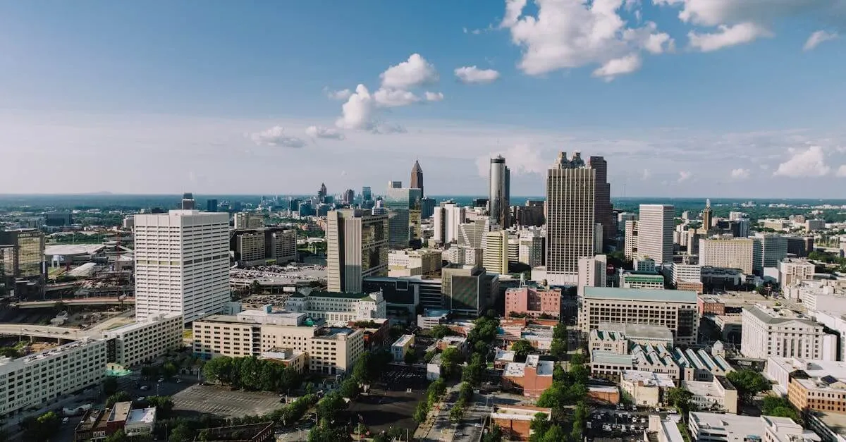 Stunning aerial view of Atlanta's modern skyline under a clear blue sky.