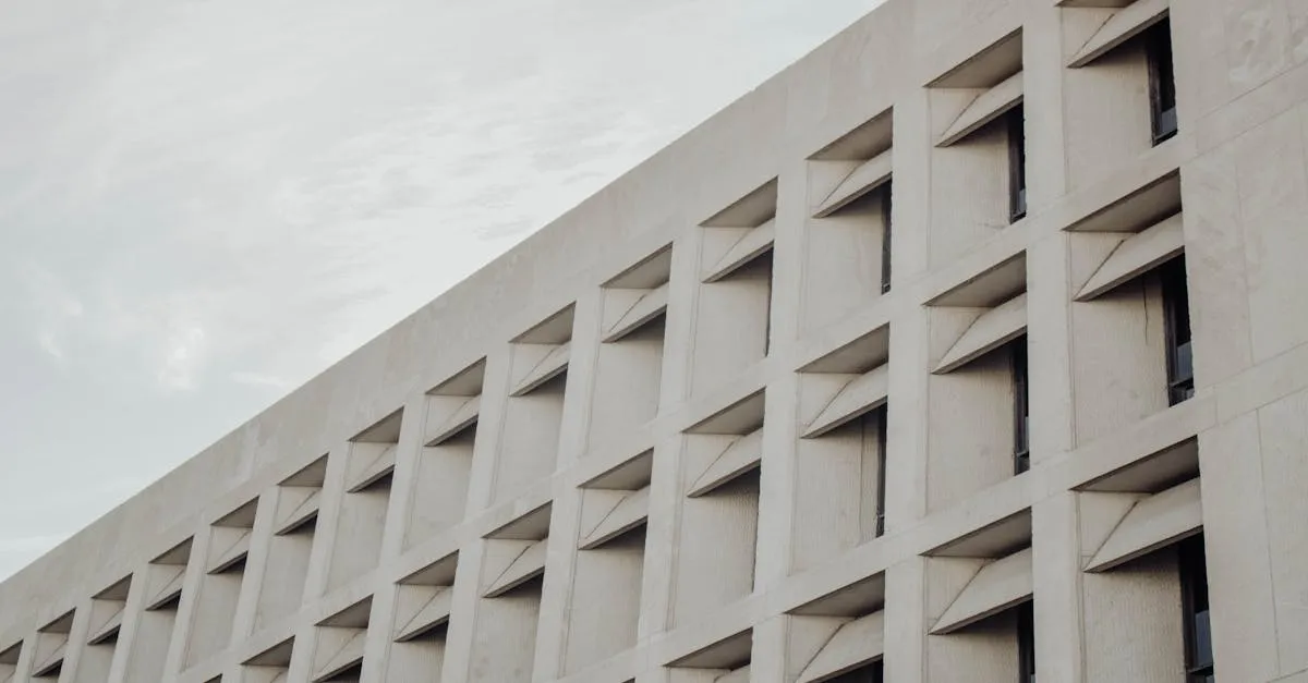 Low-angle view of a modern concrete building facade in Austin, TX.