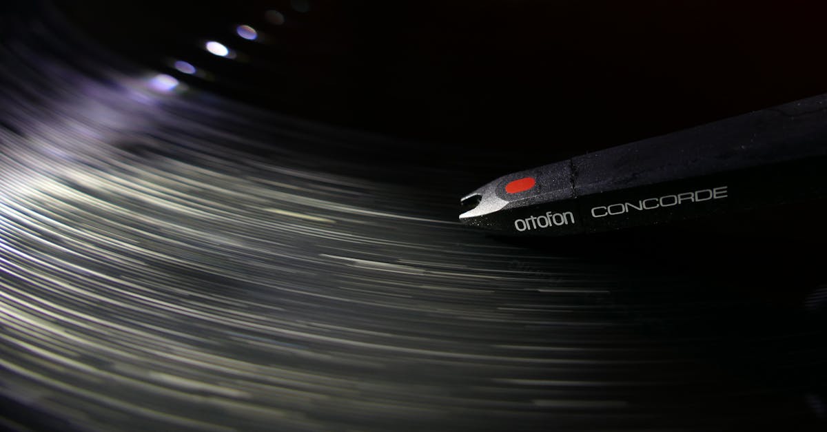 Dynamic close-up of an Ortofon Concorde needle playing a vinyl record, capturing the motion and vibe of music.