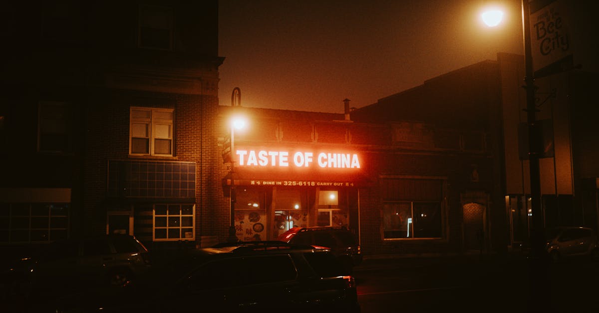 Moody nighttime street scene featuring the Taste of China restaurant in Council Bluffs.