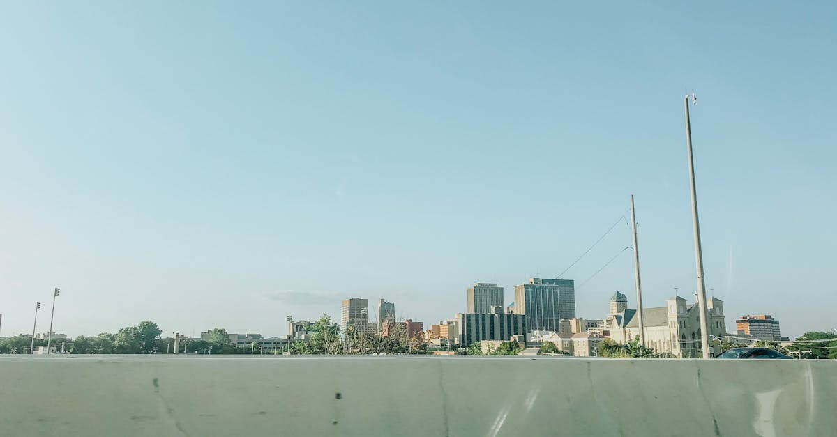 Scenic view of downtown Dayton skyline under a clear blue sky, ideal for urban landscapes.