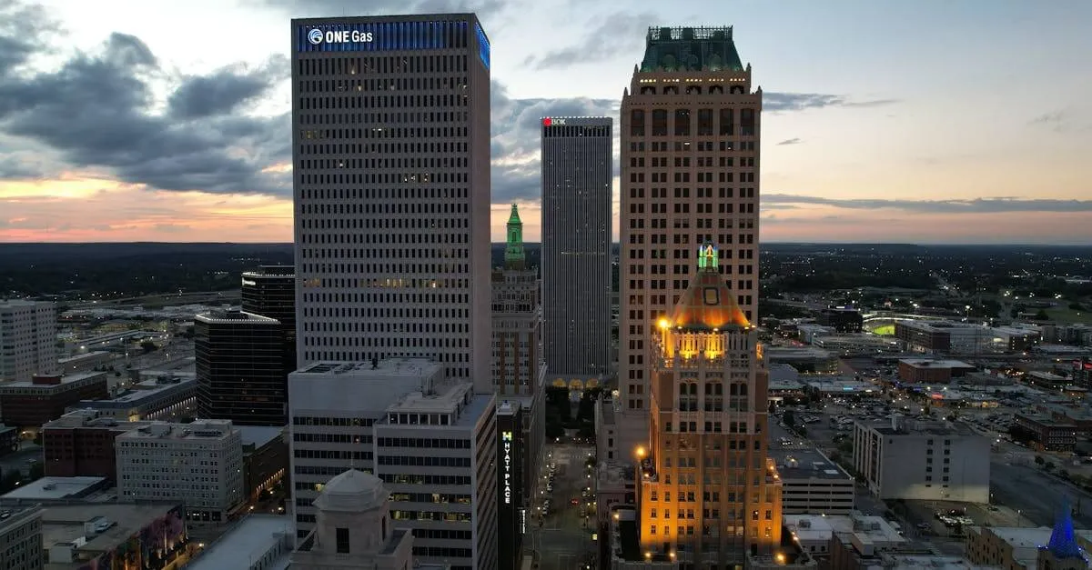 Explore Tulsa's downtown skyline at twilight with stunning architecture and vibrant evening lights.