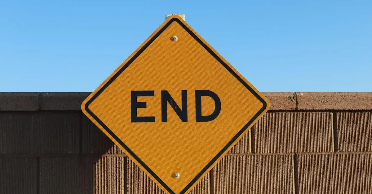 Yellow 'END' sign in Elk Grove, California, with a bright blue sky and brick wall backdrop.