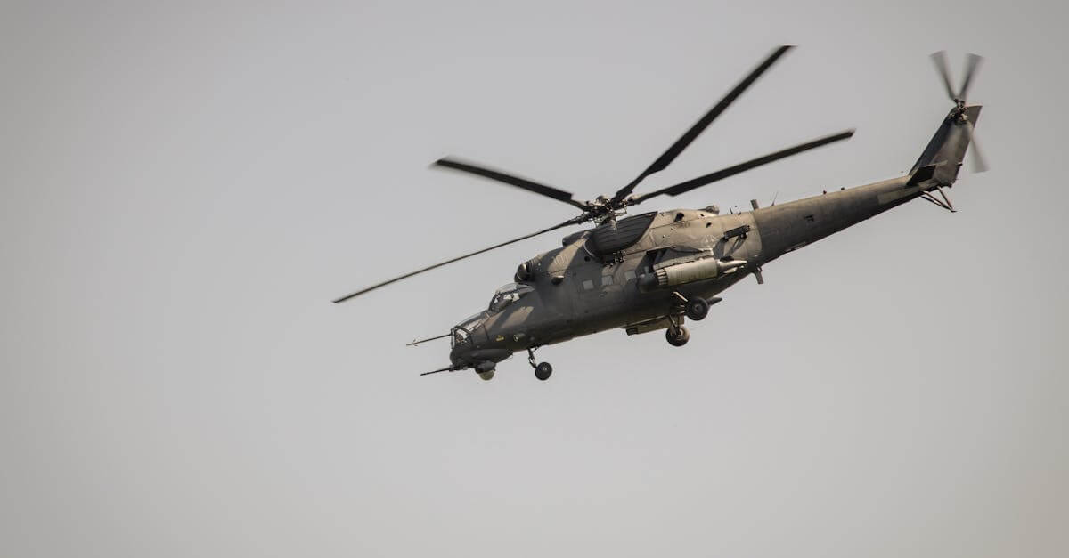 A military helicopter flying at a low angle against a clear sky in Belgrade, Serbia.