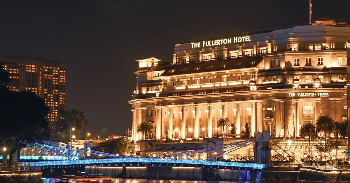 Stunning nighttime view of The Fullerton Hotel in Singapore, beautifully illuminated along the waterfront.
