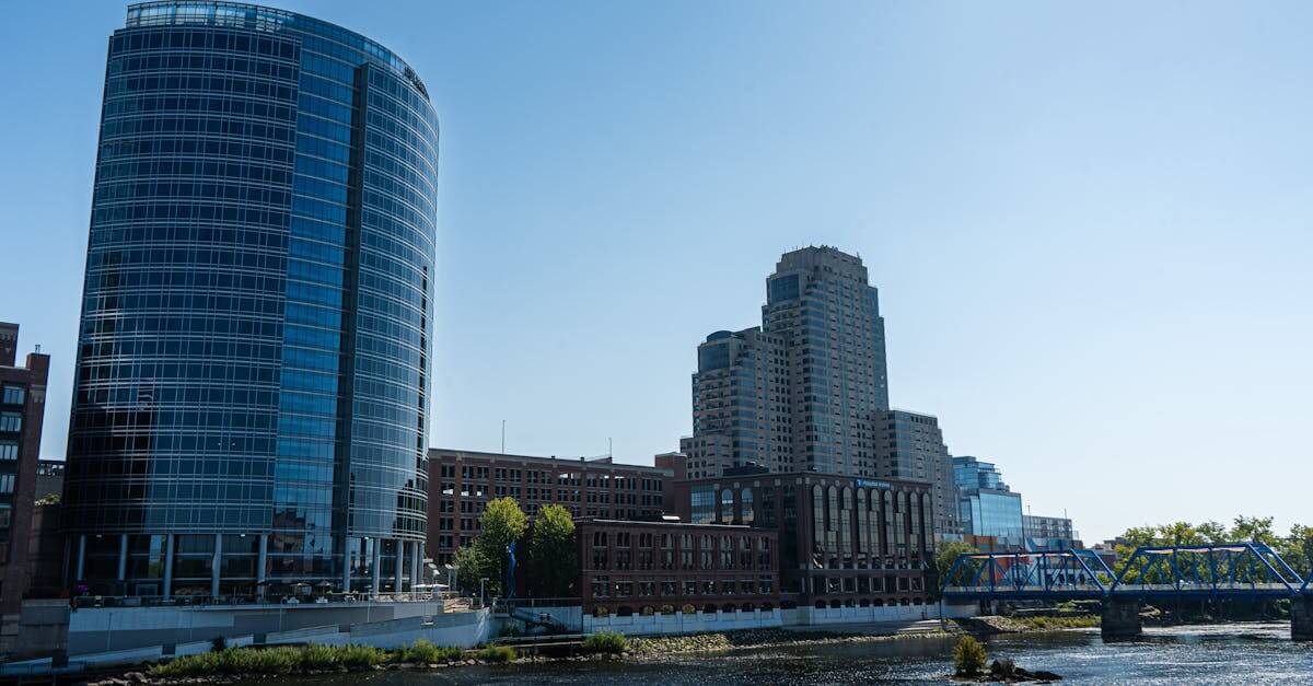 Scenic view of Grand Rapids skyline featuring the iconic Blue Bridge and modern architecture by the Grand River in Michigan.