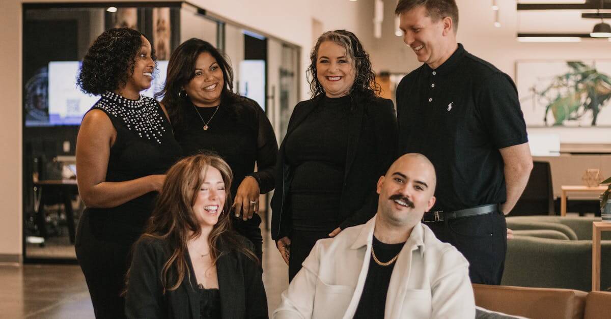 A group of professionals sharing a moment in a modern office setting.