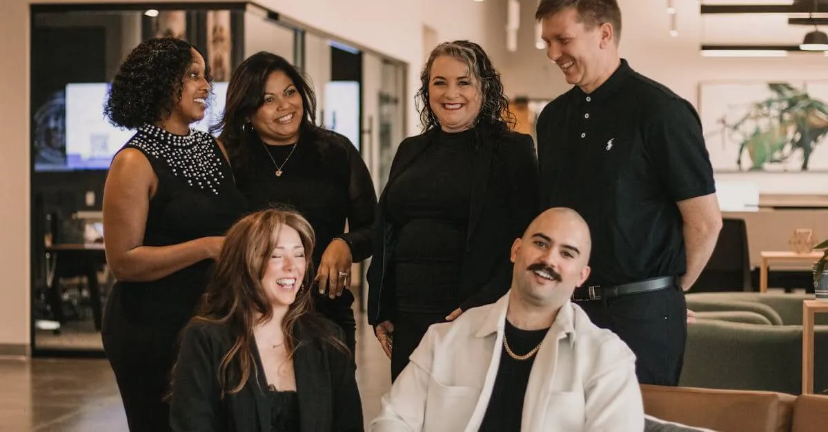 A group of professionals sharing a moment in a modern office setting.