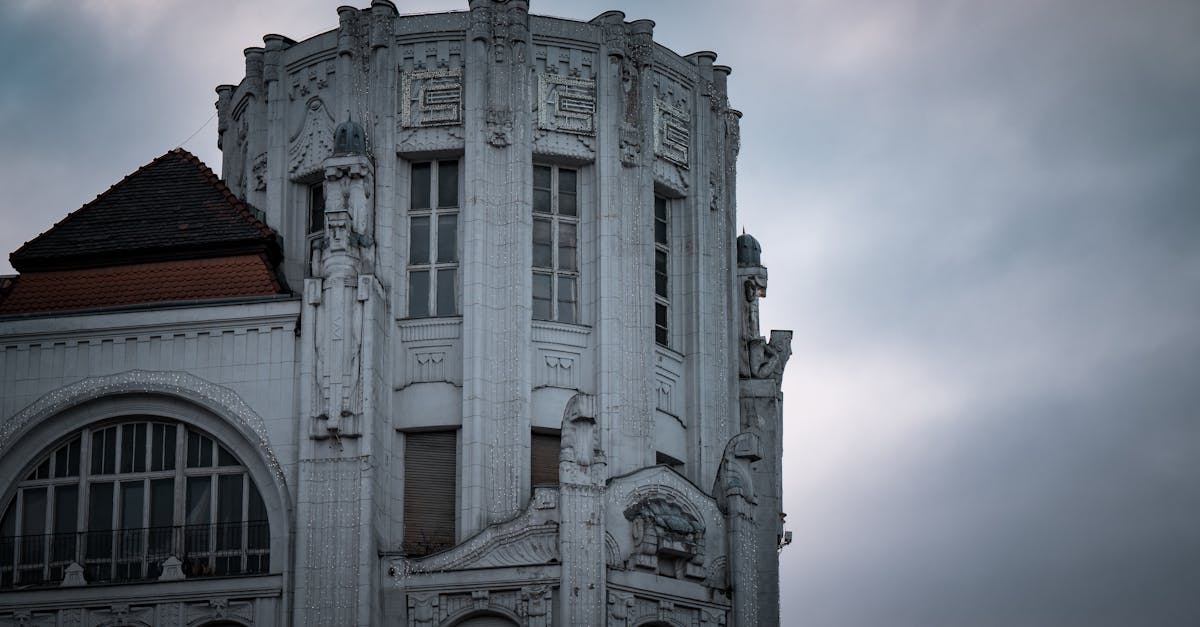 Close-up of an art nouveau building façade in Budapest, Hungary, showcasing intricate architectural details.