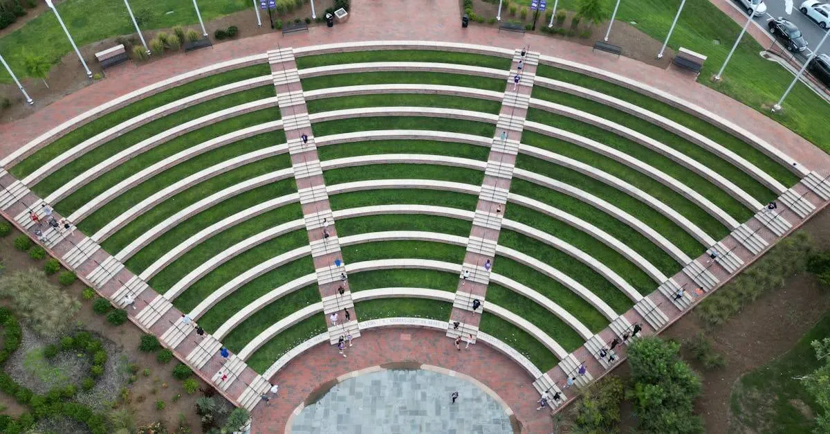 Aerial view of Cottrell Amphitheater at High Point University, showcasing its circular design and lush greenery.