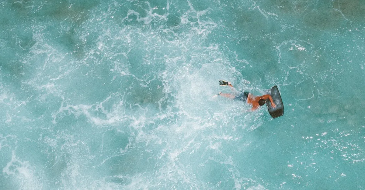 A surfer rides the turquoise waves of Hawaii from an aerial perspective. Ocean adventure and excitement.