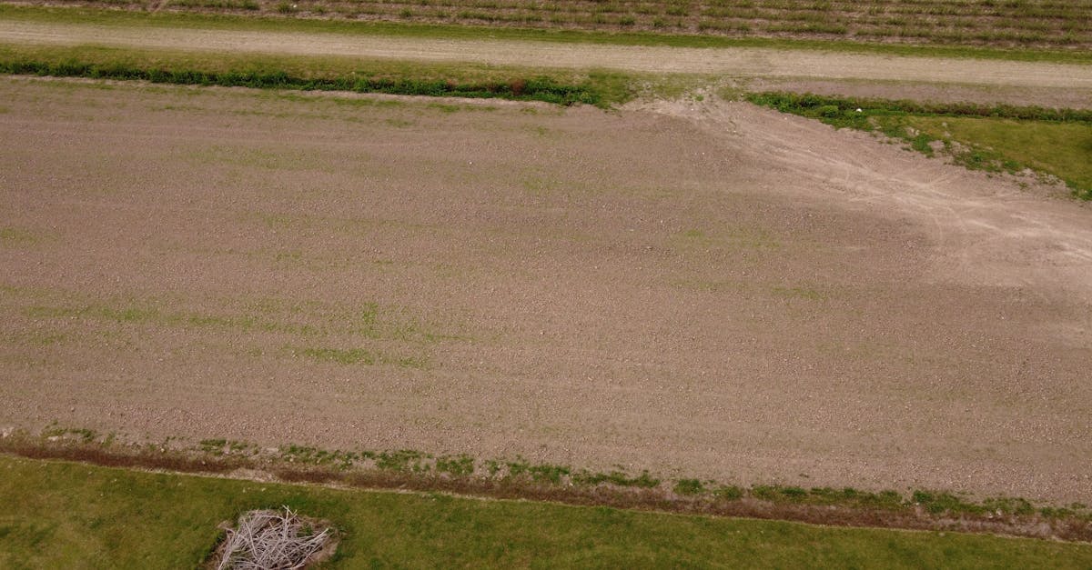 Aerial view of a plowed agricultural field in Houma, Louisiana, showcasing rural farmland.