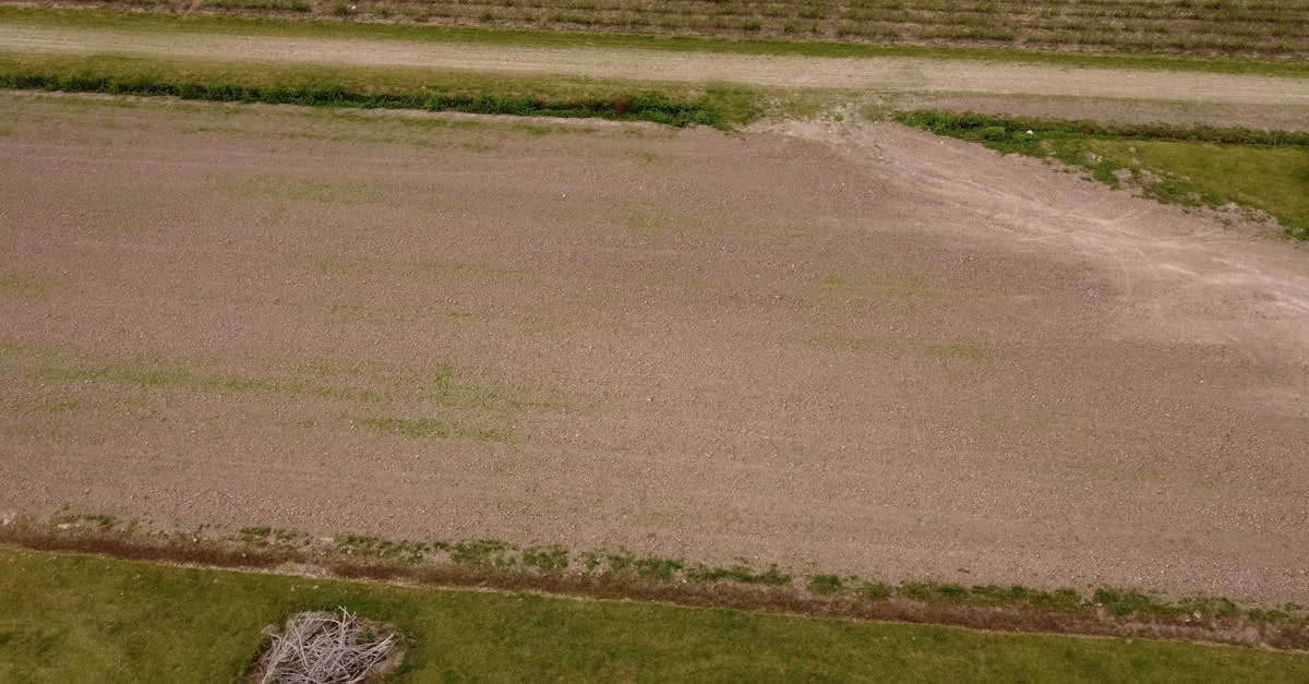Aerial view of a plowed agricultural field in Houma, Louisiana, showcasing rural farmland.