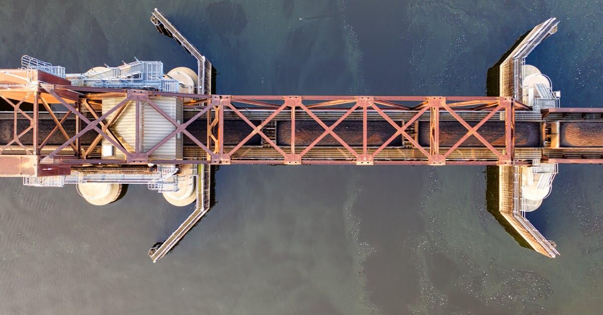 Top-down view of a steel bridge spanning a calm river in La Crosse, Wisconsin.