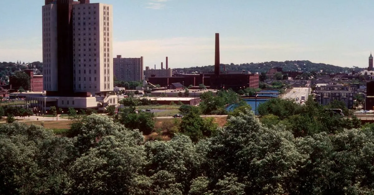 Skyline of Lowell, Massachusetts with prominent buildings and smokestacks.