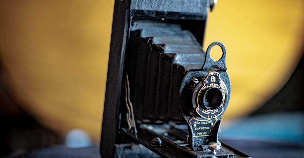Close-up of a vintage folding camera highlighting its classic design and antique appeal.