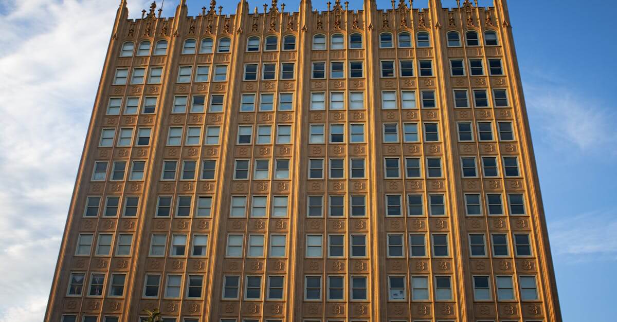 Golden architecture of a historic building in Midland, Texas under a clear blue sky.