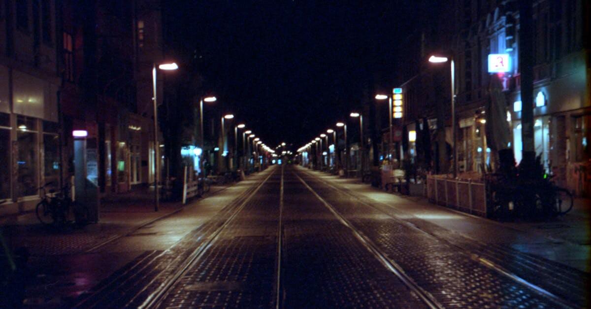Deserted street scene at night in Hannover, showcasing urban architecture and street lighting.