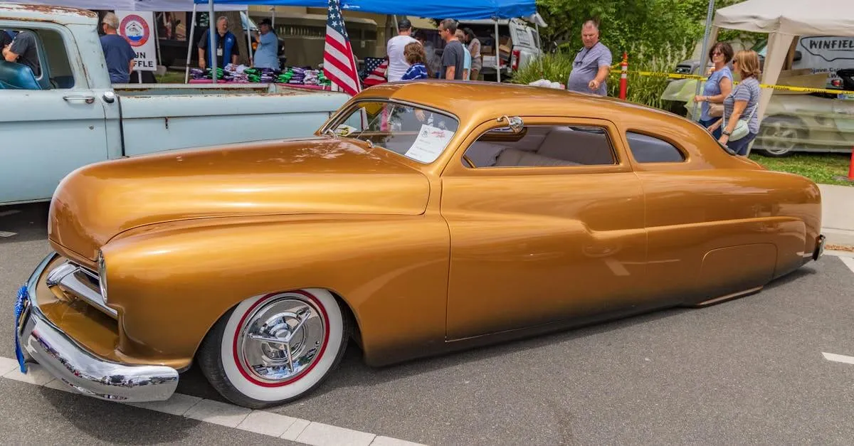 Classic gold vintage car on display at a public show in Modesto, California, highlighting luxury automotive design.
