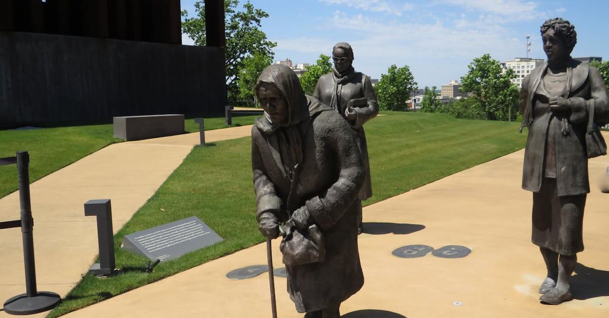 Statues at a memorial park in Montgomery, AL, honoring historical figures.