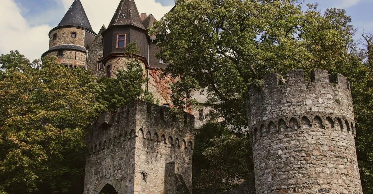 Explore the enchanting towers and historic architecture of Braunfels Castle amidst lush greenery.