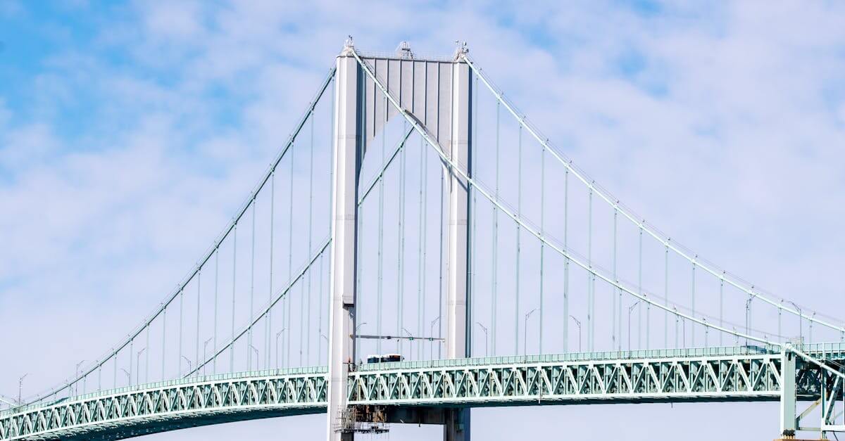 Captivating view of the Newport Pell Bridge against a bright blue sky in Rhode Island.