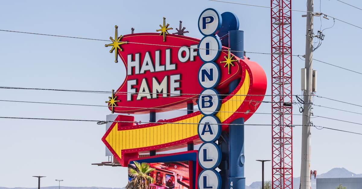 Vibrant sign of the Pinball Hall of Fame in Las Vegas, Nevada, captured outdoors in daylight.