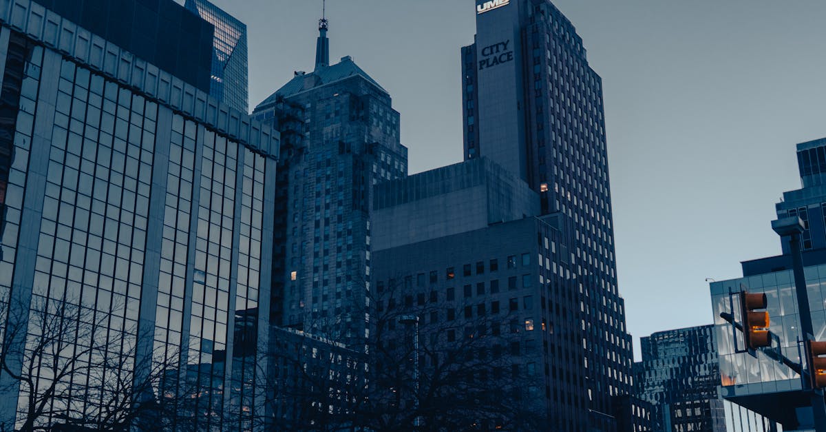 Low-angle view of Oklahoma City skyscrapers at dusk, showcasing modern urban architecture.