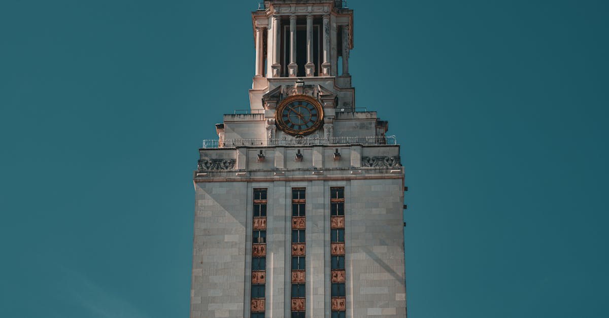 The University of Texas Tower against a clear blue sky in Austin, Texas.