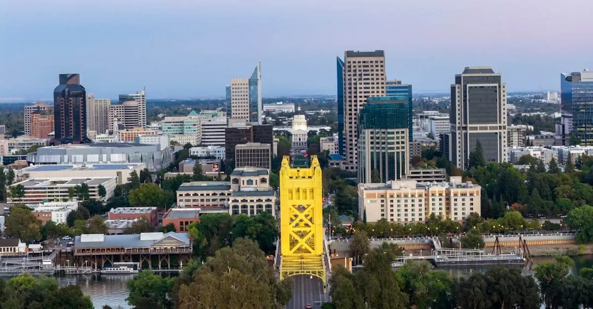 Aerial view of Sacramento showing the iconic Tower Bridge and city skyline at dusk.