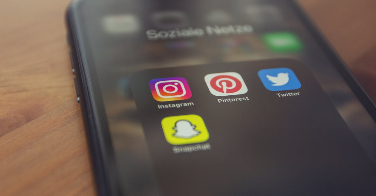 Smartphone displaying popular social media apps like Instagram, Pinterest, Twitter, and Snapchat.