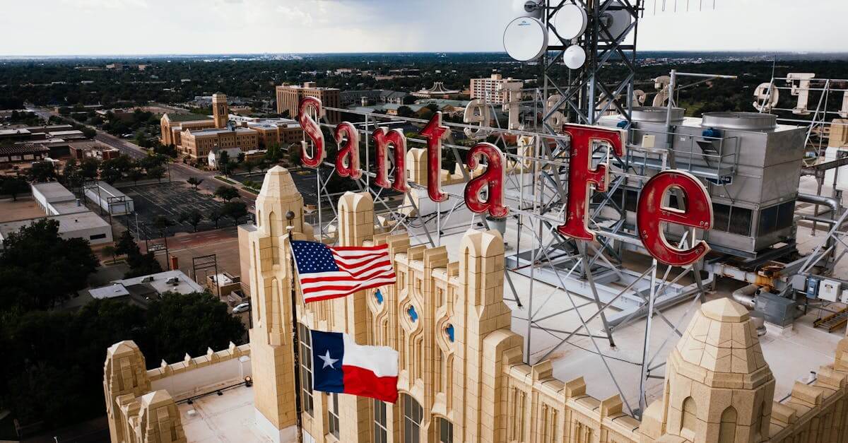 Aerial view of Santa Fe building rooftop with American and Texas flags in Amarillo, Texas.