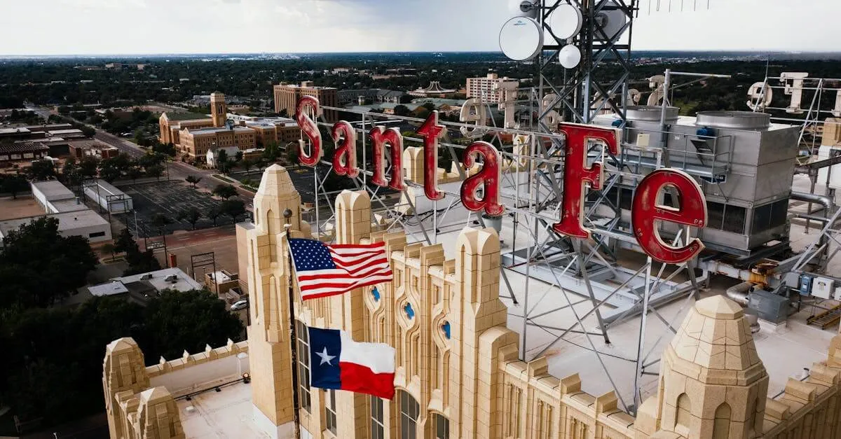 Aerial view of Santa Fe building rooftop with American and Texas flags in Amarillo, Texas.