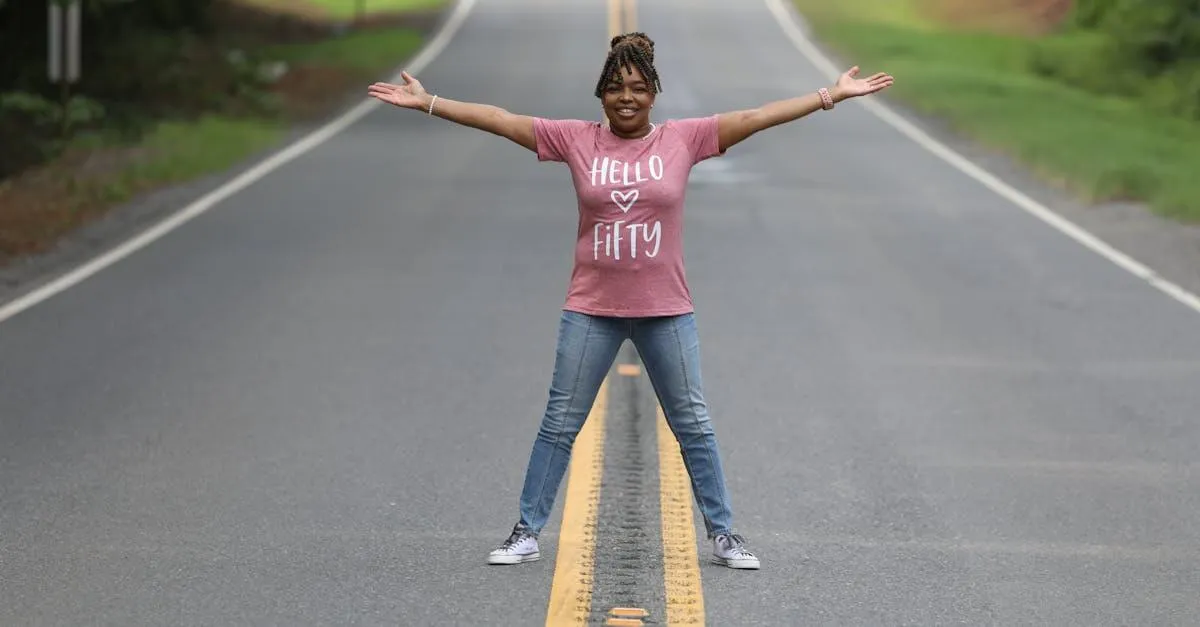 A cheerful woman celebrating her 50th birthday on a rural road in Shreveport, Louisiana.