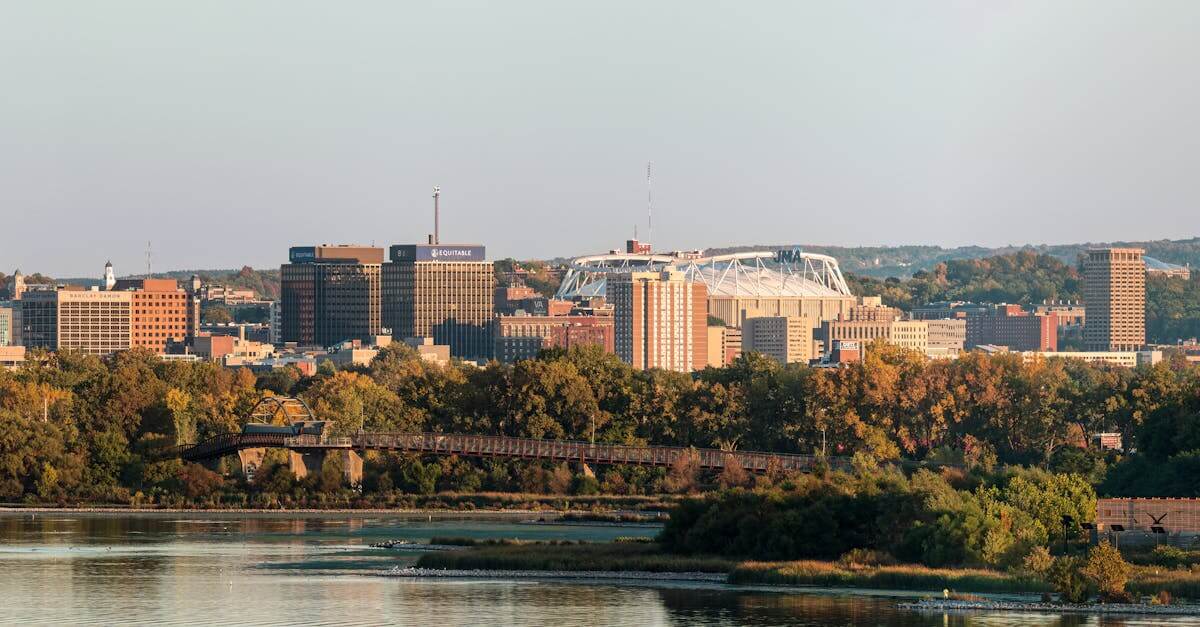 Panoramic view of Syracuse, New York skyline above Onondaga Lake during fall.