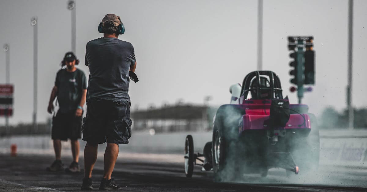 High-speed drag racing action captured on a sunny day at Topeka Raceway.
